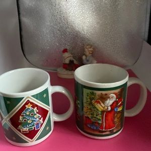 Libby Wilkie GHA Christmas mug along with another green Christmas mug